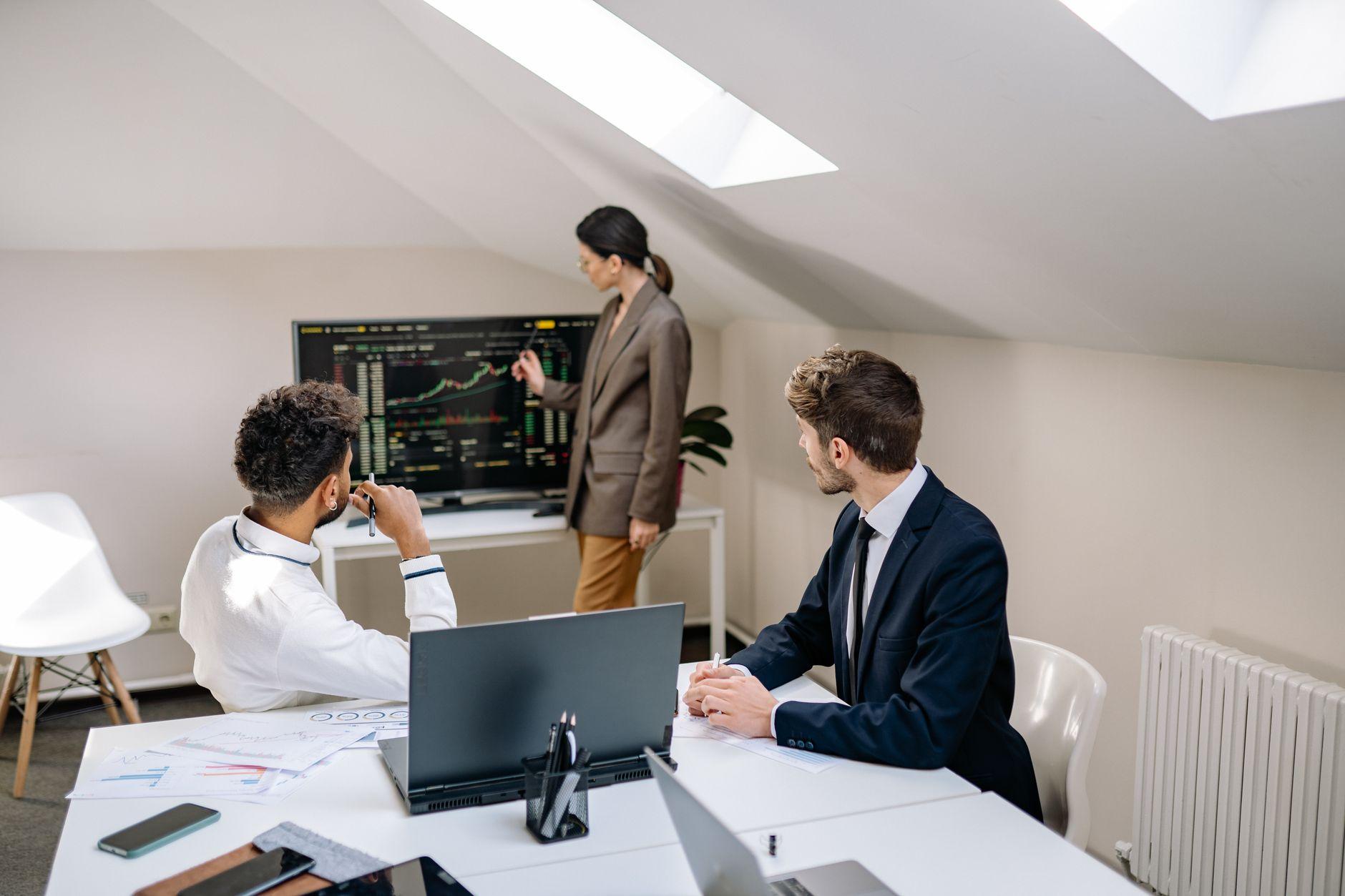 a group of men having a meeting in the office